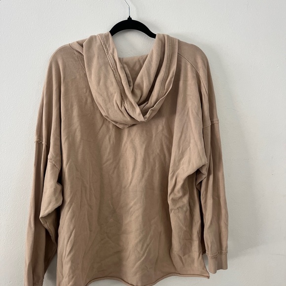 Peachy tan hoodie with crisscross strings from area - Picture 3 of 4